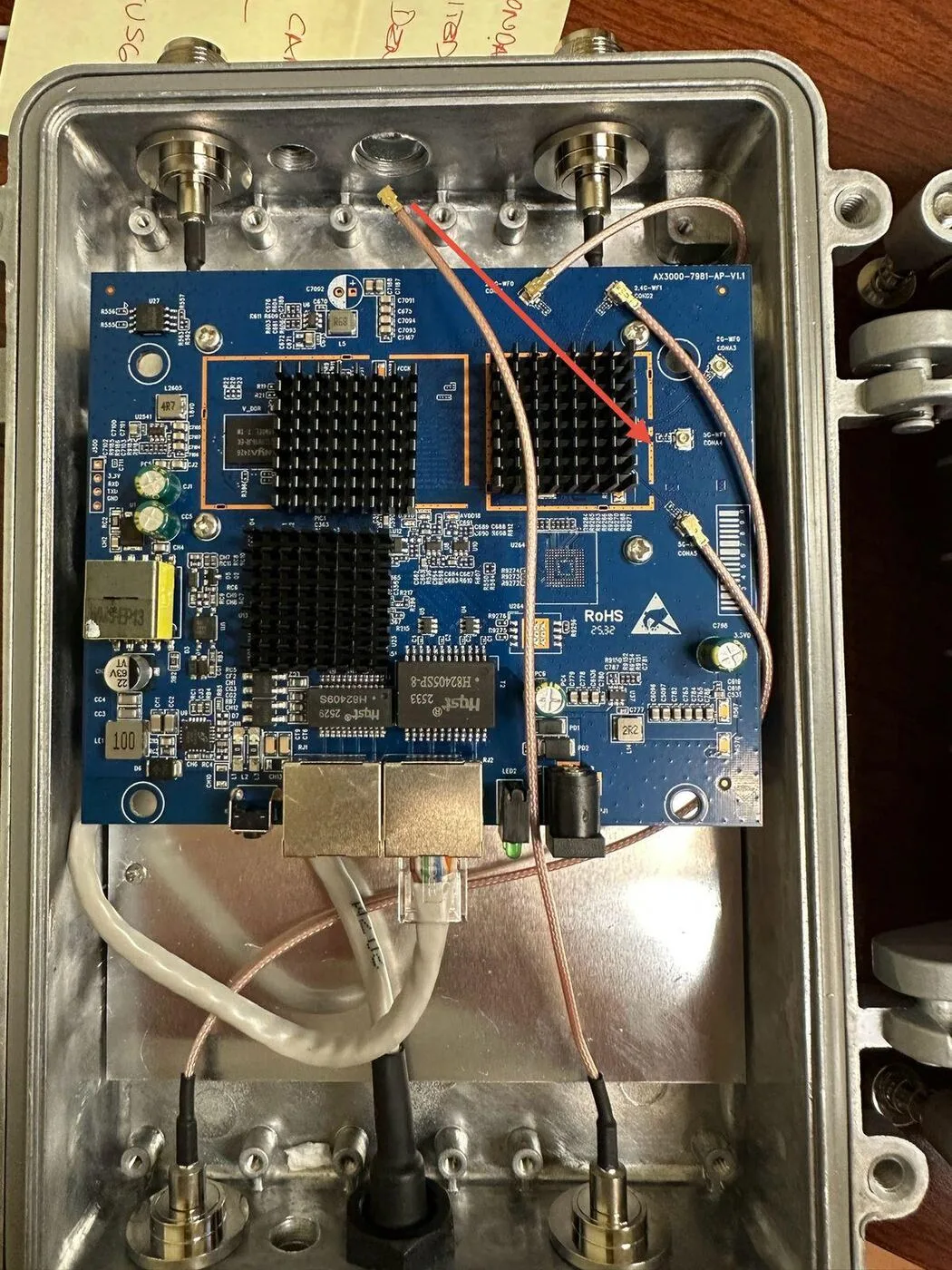 AX3000 enterprise-grade circuit board inside Modem Boost™ outdoor unit, MT7981B chipset with heatsinks